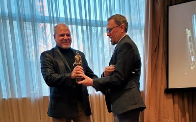 Mark Bartkoski (l) receives the Distinguished Alumni award from professor Erik Westman.